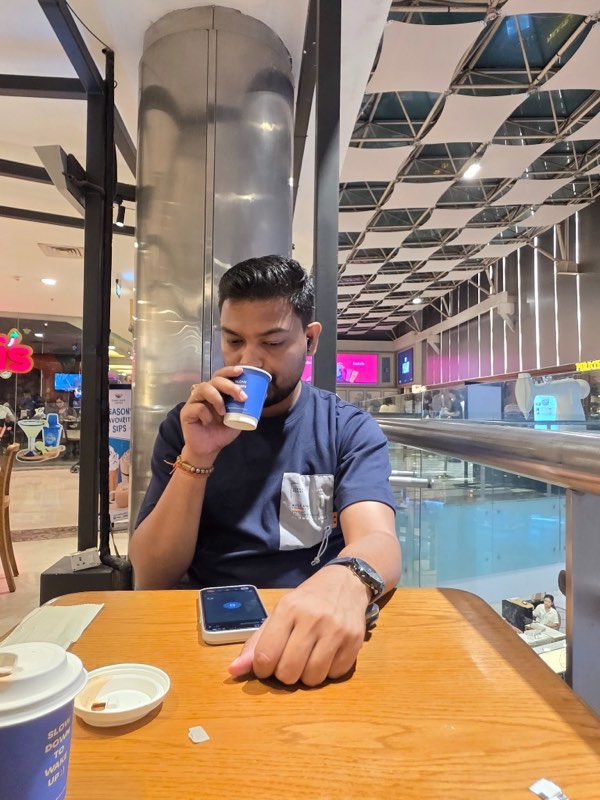 Nihar Ranjan Rout having a cup of chai at a caf&eacute; table